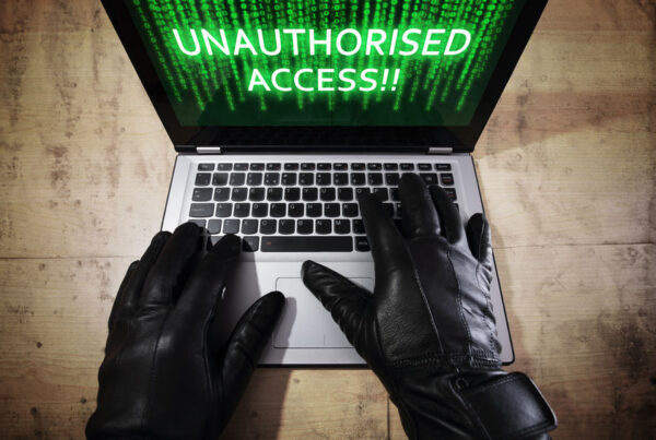 Hacker on laptop - Identity fraud