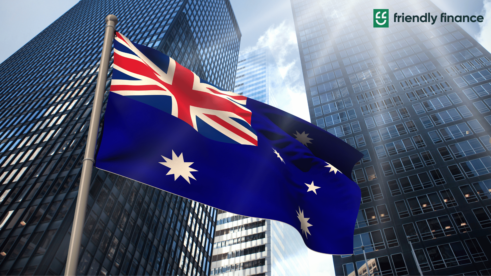 A picture of the Australian flag with tall skyscrapers in its background