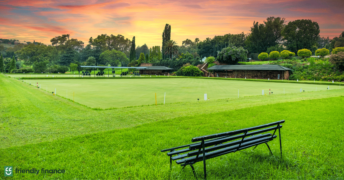 an image of a green landscape with a bench